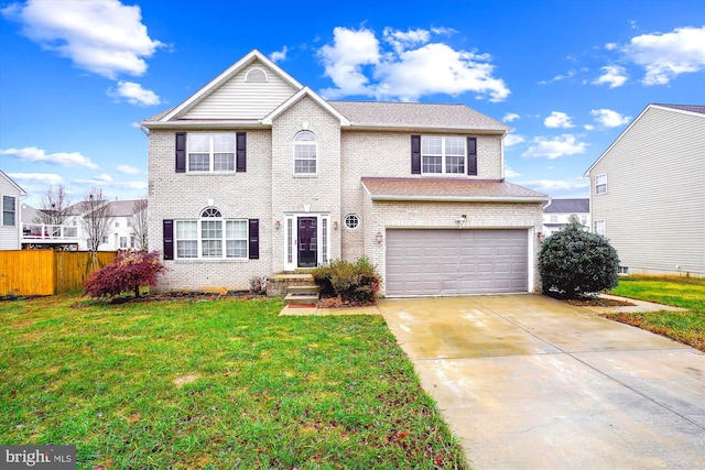 view of front of home with a garage and a front yard