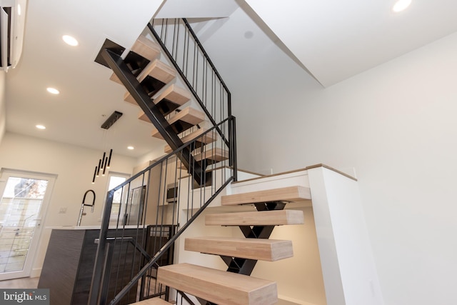 stairway featuring hardwood / wood-style flooring