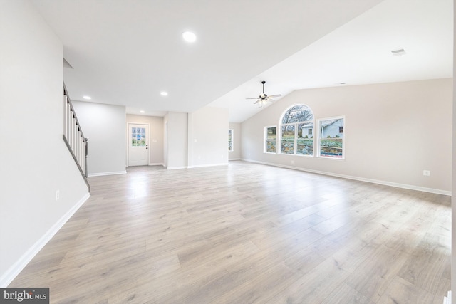 unfurnished living room featuring light wood-type flooring, ceiling fan, and lofted ceiling