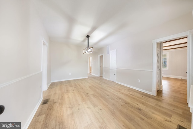 spare room with light hardwood / wood-style floors