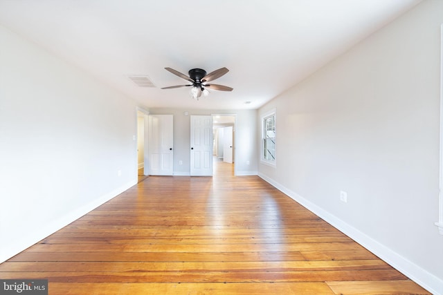 spare room featuring ceiling fan and light wood-type flooring