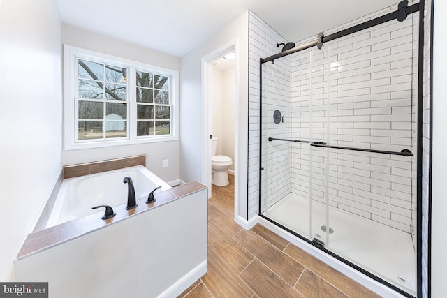 bathroom with toilet and independent shower and bath