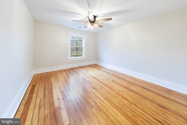 empty room featuring ceiling fan and light hardwood / wood-style floors