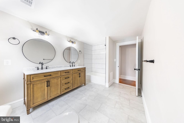 bathroom featuring tile patterned flooring and vanity