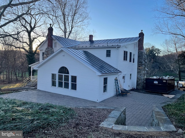 rear view of property with a patio area