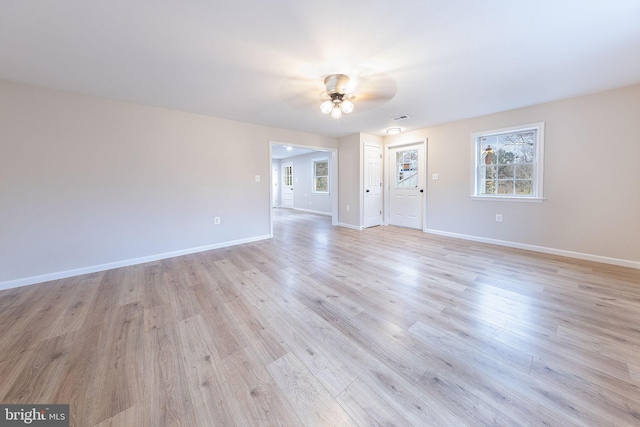 unfurnished living room featuring light wood-type flooring and ceiling fan