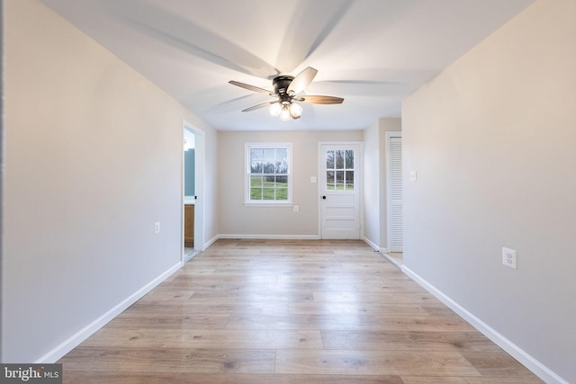 interior space with ceiling fan and light wood-type flooring