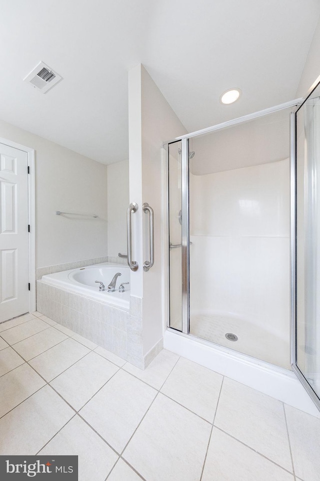 bathroom featuring tile patterned flooring and plus walk in shower