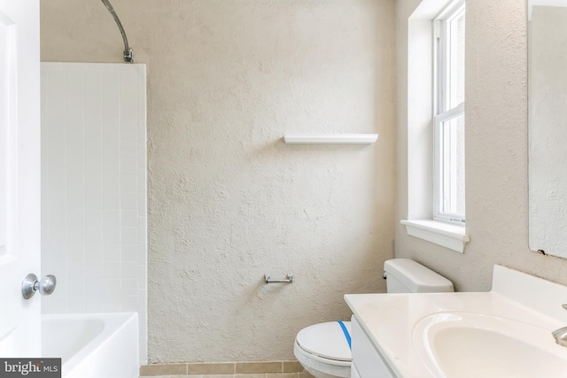 full bathroom with toilet, shower / bathing tub combination, vanity, and tile patterned floors