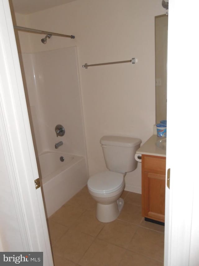 full bathroom featuring toilet, vanity, shower / bath combination, and tile patterned floors