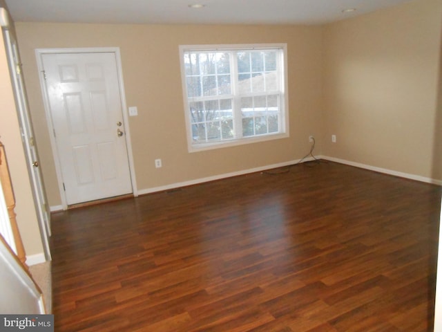 entryway with dark hardwood / wood-style floors