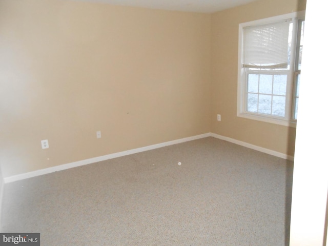 unfurnished room with carpet floors