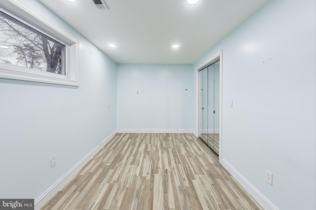 unfurnished room with light hardwood / wood-style flooring