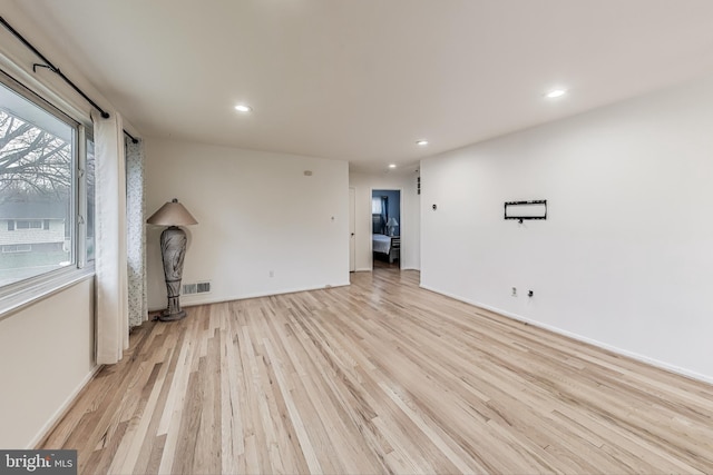 unfurnished living room with light hardwood / wood-style floors