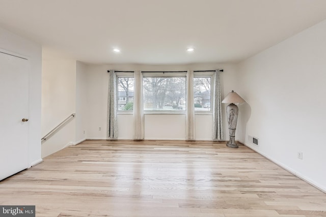 empty room with light wood-type flooring