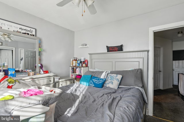 bedroom with dark carpet and ceiling fan