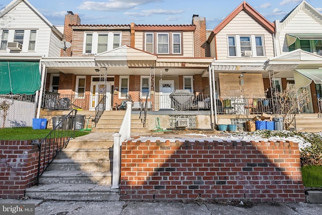 view of property with covered porch