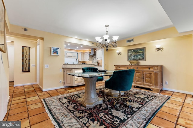 tiled dining space with a chandelier and sink