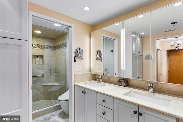 bathroom featuring tile patterned flooring, vanity, an enclosed shower, and toilet