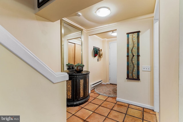 hall with tile patterned flooring, ornamental molding, and a baseboard heating unit