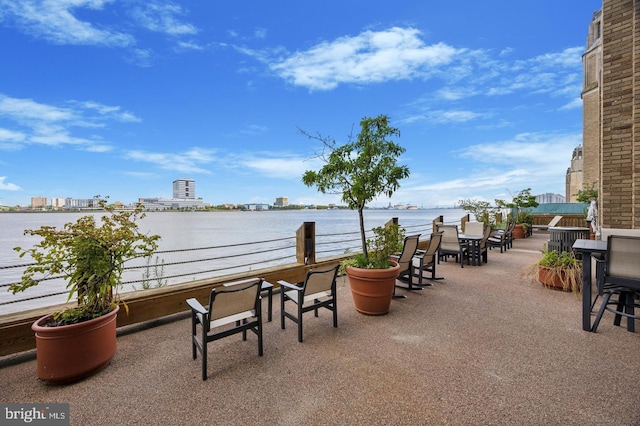 view of patio featuring a water view