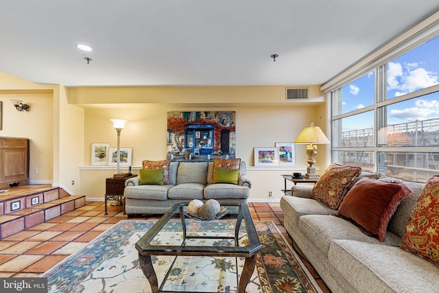 living room with tile patterned flooring