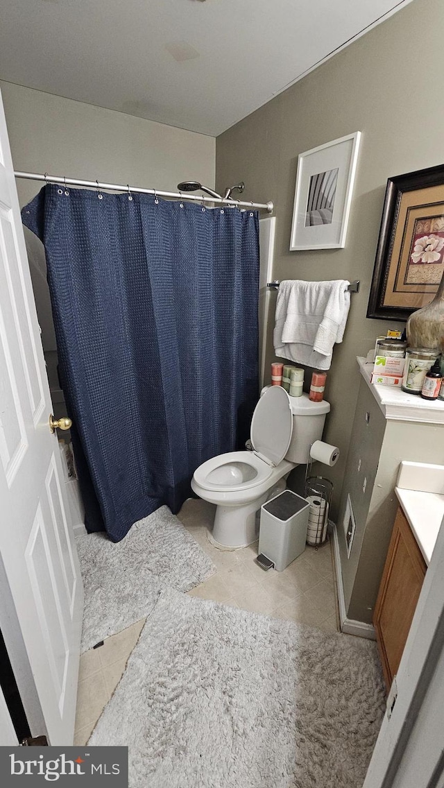 bathroom featuring vanity, a shower with curtain, and toilet