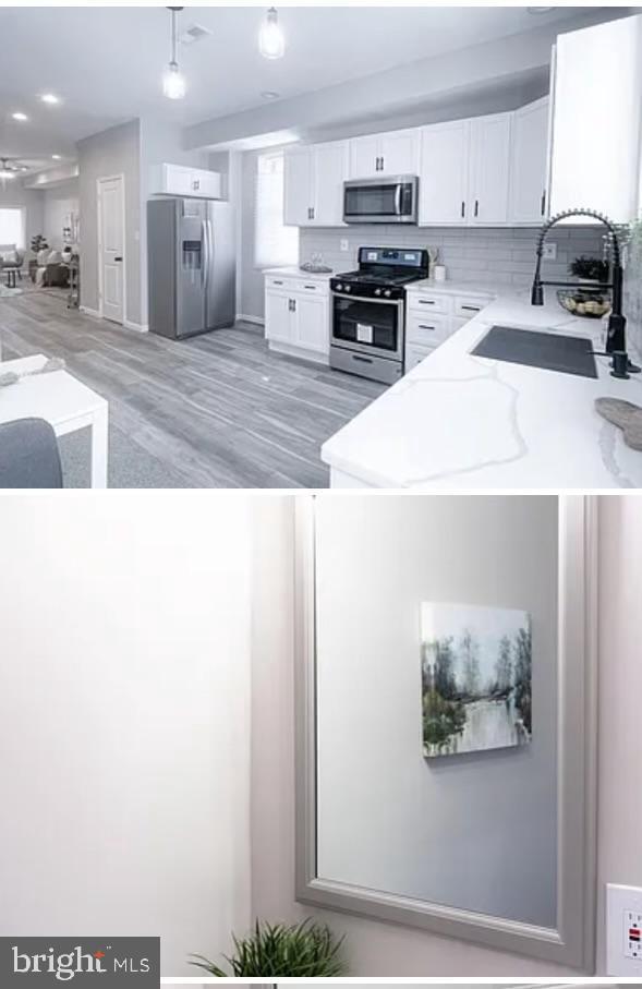 kitchen featuring sink, white cabinets, stainless steel appliances, and light hardwood / wood-style flooring