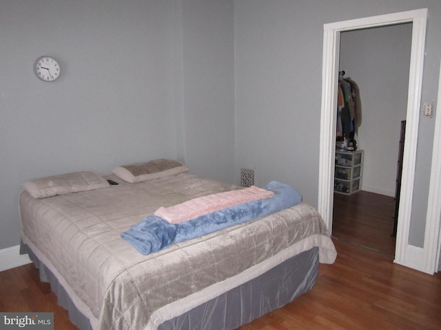 bedroom featuring dark wood-type flooring