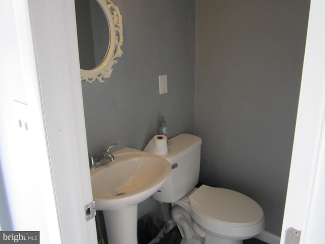 bathroom with toilet and sink