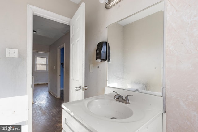 bathroom with hardwood / wood-style floors and vanity