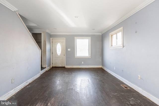 foyer entrance with dark hardwood / wood-style floors and ornamental molding