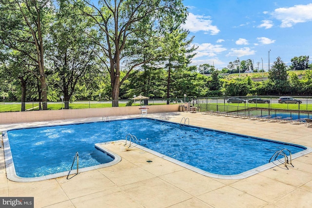 view of pool featuring a patio