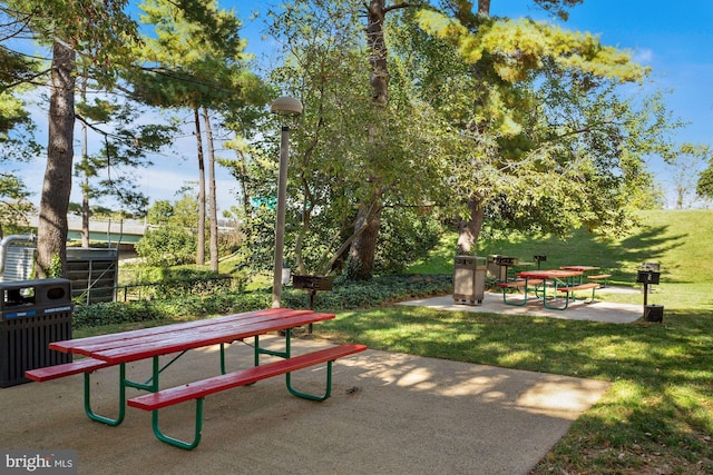 surrounding community featuring a yard and a patio area