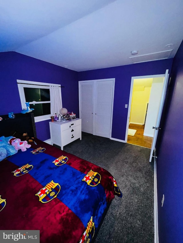 carpeted bedroom featuring lofted ceiling