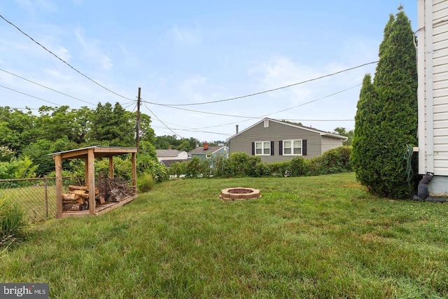 view of yard featuring an outdoor fire pit