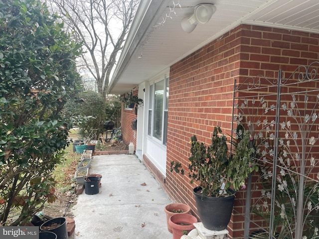 view of side of home with a patio area