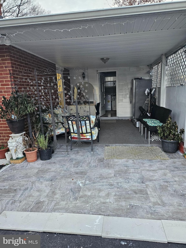 view of patio / terrace with a carport