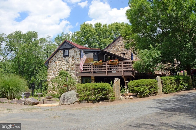 back of house with a wooden deck