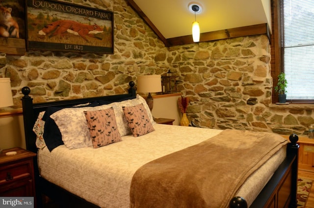 bedroom featuring vaulted ceiling