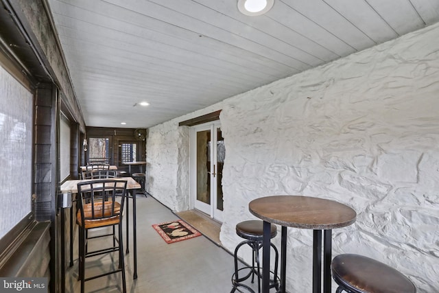 sunroom / solarium featuring french doors