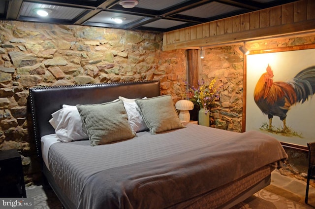 bedroom with beamed ceiling and coffered ceiling