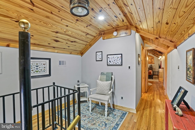 bedroom featuring lofted ceiling, light hardwood / wood-style floors, and wood ceiling