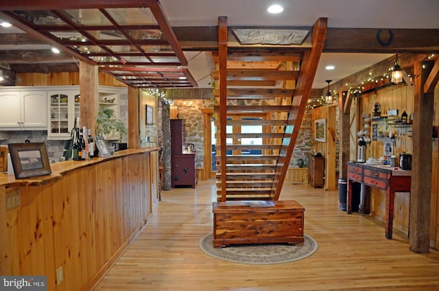 kitchen featuring pendant lighting, light hardwood / wood-style flooring, and white cabinetry