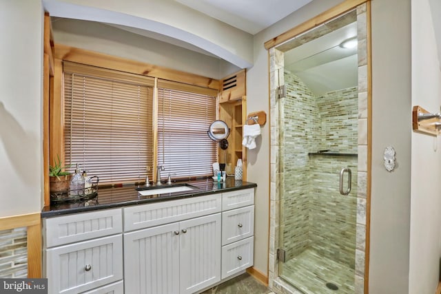 bathroom with vanity and walk in shower