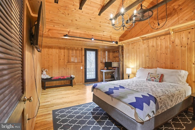 bedroom with beamed ceiling, wood walls, wooden ceiling, and hardwood / wood-style floors