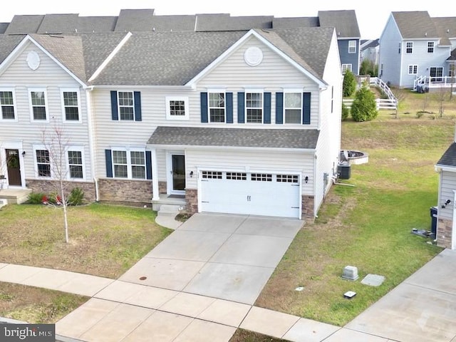 view of front of home featuring a garage and a front yard