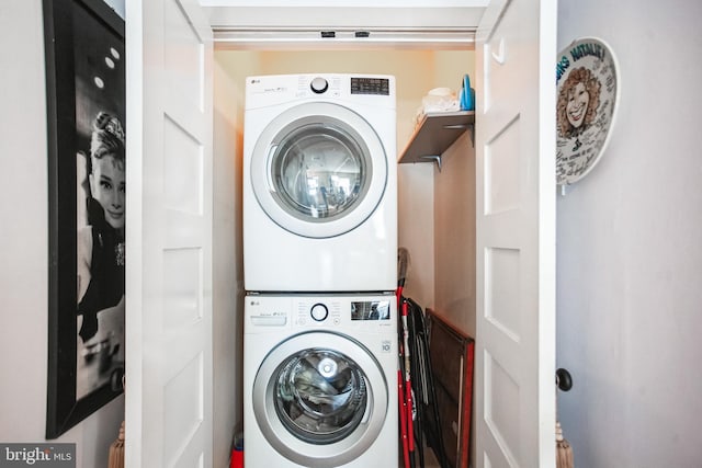 laundry room featuring stacked washing maching and dryer