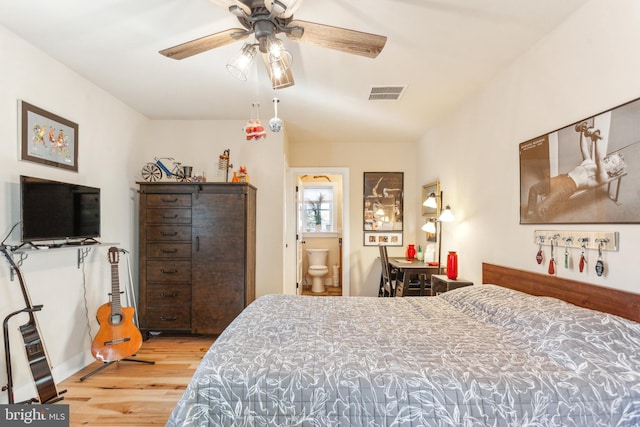 bedroom featuring ensuite bath, ceiling fan, and hardwood / wood-style flooring