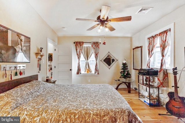 bedroom featuring ceiling fan and light hardwood / wood-style floors